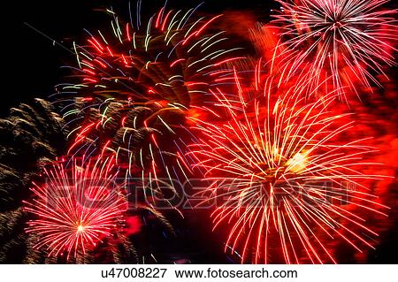 Stock Photo - Firework display on 4th of July at night. Fotosearch