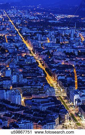 Stock Image - France, Auvergne-Rhone-Alpes, Grenoble, Grenoble panorama at evening. Fotosearch