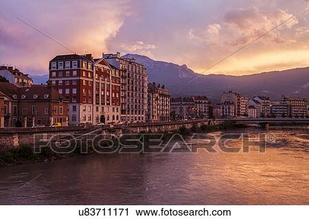 France, Auvergne-Rhone-Alpes, Grenoble, Grenoble architecture along Isere River seen at sunset View Large Photo Image Stock Image - France, Auvergne-Rhone-Alpes, Grenoble, Grenoble architecture along Isere River seen at sunset. Fotosearch