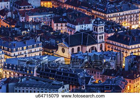 Stock Photo - France, Auvergne-Rhone-Alpes, Grenoble, Grenoble panorama at evening. Fotosearch