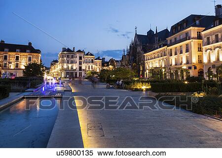 Stock Photography - France, Grand Est, Troyes, Illuminated promenade along canal. Fotosearch