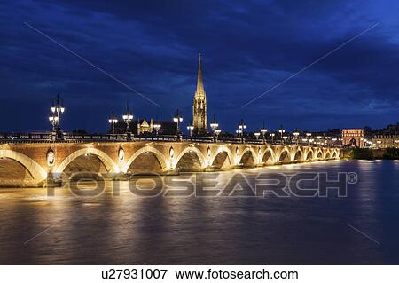 Stock Photo - France, Nouvelle-Aquitaine, Bordeaux, Illuminated Pierre Bridge. Fotosearch