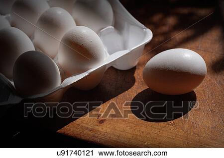 Fresh eggs in carton on table View Large Photo Image Stock Image - Fresh eggs in carton on table. Fotosearch
