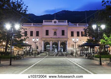 Picture - Gibraltar, Gibraltar City, Gibraltar Parliament on John Mackintosh Square at night. Fotosearch