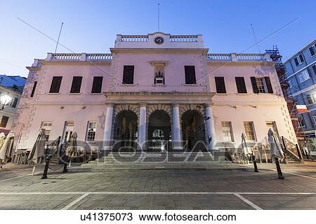 Gibraltar, Gibraltar City, Gibraltar Parliament on John Mackintosh Square at dusk View Large Photo Image Stock Image - Gibraltar, Gibraltar City, Gibraltar Parliament on John Mackintosh Square at dusk. Fotosearch