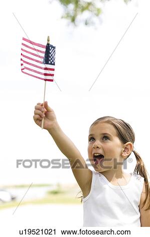 Girl (4-5) holding american flag View Large Photo Image Stock Image - Girl (4-5) holding american flag. Fotosearch