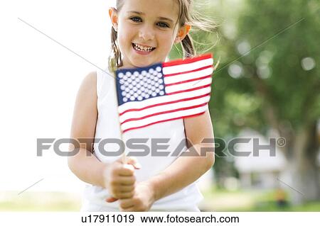 Girl (4-5) holding american flag View Large Photo Image Stock Photo - Girl (4-5) holding american flag. Fotosearch