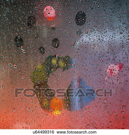 Stock Photograph - Glass with water droplets and handprint. Fotosearch