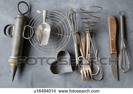 Picture - Group of vintage cooking utensils on gray background. Fotosearch