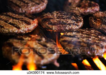 Hamburgers on barbeque grill View Large Photo Image Picture - Hamburgers on barbeque grill. Fotosearch