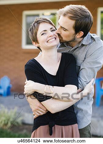 Happy couple kissing and embracing View Large Photo Image Picture - Happy couple kissing and embracing. Fotosearch