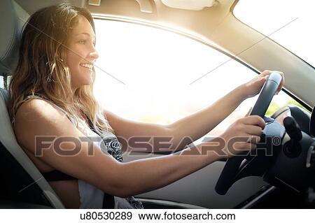 Happy woman driving View Large Photo Image Stock Photo - Happy woman driving. Fotosearch