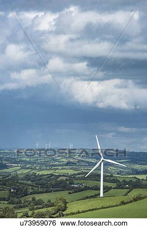 Stock Photograph - Ireland, County Cavan, Landscape with wind turbines. Fotosearch