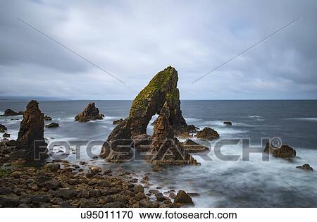 Stock Image - Ireland, County Donegal, Crophy Head rock formations in sea. Fotosearch