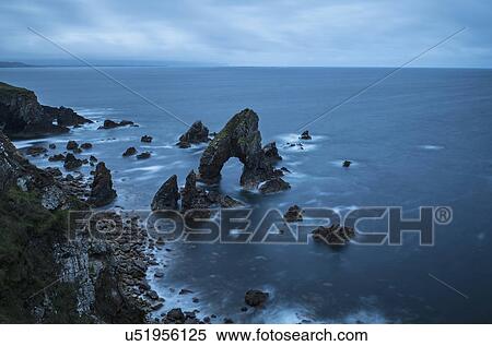 Stock Photography - Ireland, County Donegal, Crophy Head rock formation in sea. Fotosearch