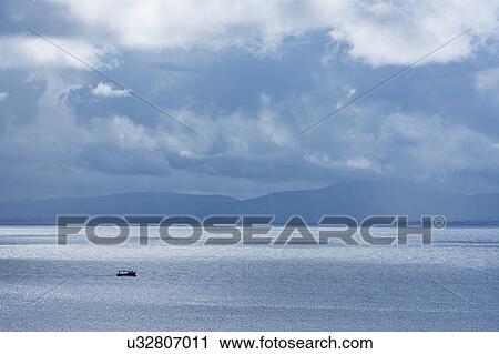 Stock Image - Ireland, County Donegal, Fishing boat on Donegal Bay seen from Wild Atlantic Way. Fotosearch
