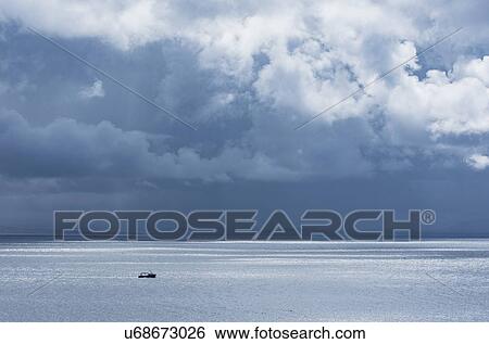 Stock Photograph - Ireland, County Donegal, Fishing boat on Donegal Bay seen from Wild Atlantic Way. Fotosearch