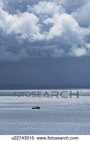 Stock Photography - Ireland, County Donegal, Fishing boat on Donegal Bay seen from Wild Atlantic Way. Fotosearch