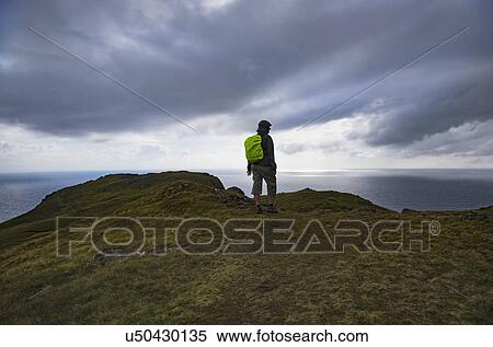 Ireland, County Donegal, Hiker looking at Donegal Bay long Wild Atlantic Way View Large Photo Image Stock Photography - Ireland, County Donegal, Hiker looking at Donegal Bay long Wild Atlantic Way. Fotosearch