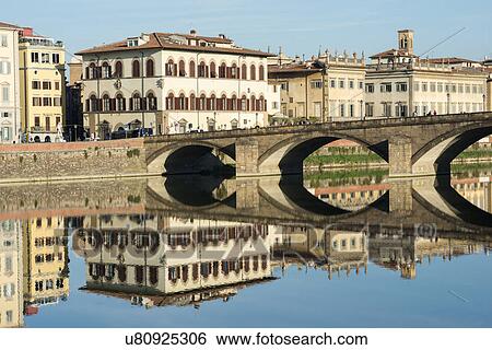 Stock Photograph - Italy, Tuscany, Florence, Bridge reflected in Arno river. Fotosearch