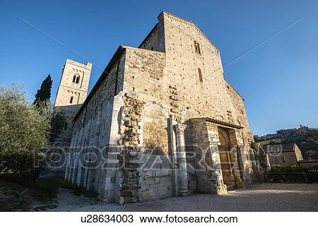 Stock Image - Italy, Tuscany, Montalcino, Facade of Abbey of Sant'Antimo near Montalcino city. Fotosearch