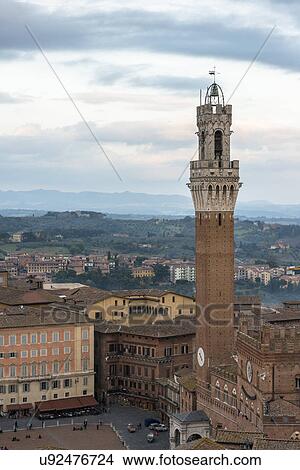 Italy, Tuscany, Siena, Pubblico Palace and bell tower Torre del Mangia, tallest ancient building in city View Large Photo Image Picture - Italy, Tuscany, Siena, Pubblico Palace and bell tower Torre del Mangia, tallest ancient building in city. Fotosearch