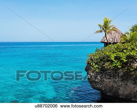 Jamaica, Negril, Traditional huts on rocky coastline View Large Photo Image Stock Photograph - Jamaica, Negril, Traditional huts on rocky coastline. Fotosearch