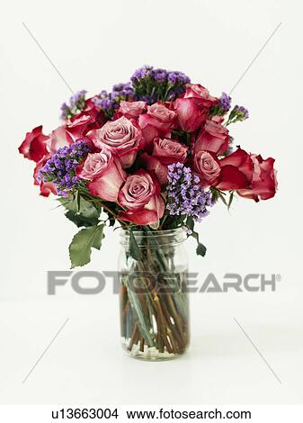 Picture - Jar with bouquet of red roses. Fotosearch