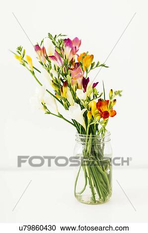 Stock Image - Jar with bunch of flowers. Fotosearch