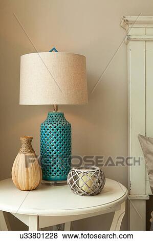 Lamp on table in bedroom View Large Photo Image Stock Photo - Lamp on table in bedroom. Fotosearch
