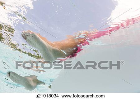 Legs of girl (4-5) underwater View Large Photo Image Picture - Legs of girl (4-5) underwater. Fotosearch
