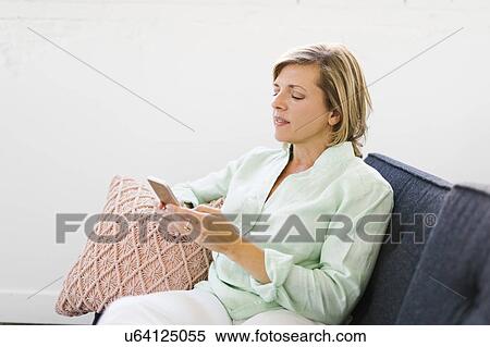 Mature woman using phone View Large Photo Image Stock Photography - Mature woman using phone. Fotosearch