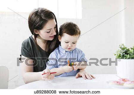 Stock Photo - Mother drawing with son (4-5). Fotosearch