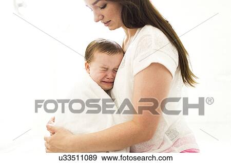 Mother embracing and consoling son (4-5) View Large Photo Image Stock Photo - Mother embracing and consoling son (4-5). Fotosearch