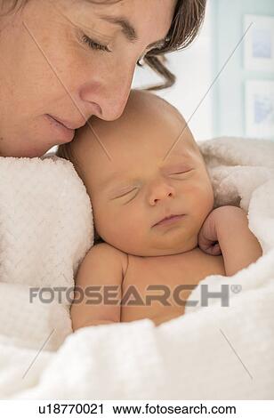 Mother embracing newborn son (0-1 month) View Large Photo Image Stock Image - Mother embracing newborn son (0-1 month). Fotosearch