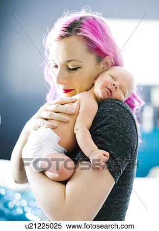 Mother embracing newborn son (2-5 months) View Large Photo Image Stock Photography - Mother embracing newborn son (2-5 months). Fotosearch