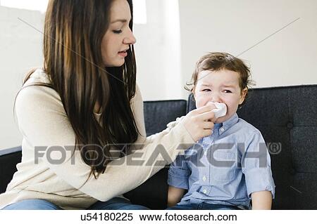 Mother helping son (4-5) blow nose View Large Photo Image Stock Photography - Mother helping son (4-5) blow nose. Fotosearch
