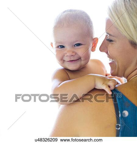 Mother holding baby boy (18-23 months) View Large Photo Image Stock Photo - Mother holding baby boy (18-23 months). Fotosearch