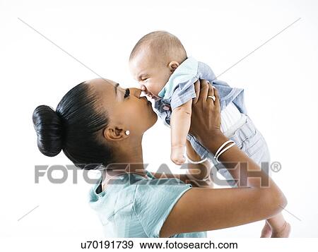 Mother holding baby boy (2-5 months) View Large Photo Image Stock Photo - Mother holding baby boy (2-5 months). Fotosearch