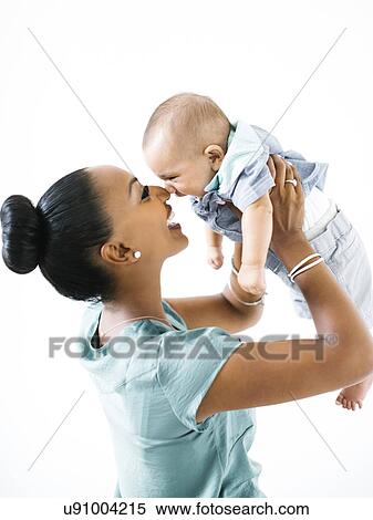 Mother holding baby boy (2-5 months) View Large Photo Image Stock Photography - Mother holding baby boy (2-5 months). Fotosearch