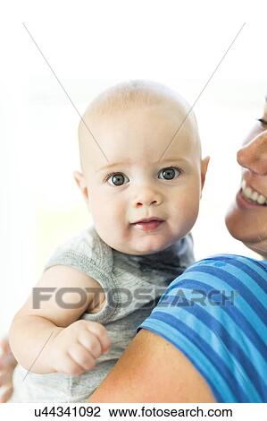 Mother holding son (6-11 months) View Large Photo Image Stock Image - Mother holding son (6-11 months). Fotosearch