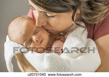 Mother kissing baby boy (0-1 months) View Large Photo Image Stock Image - Mother kissing baby boy (0-1 months). Fotosearch