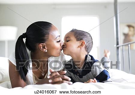 Mother kissing son (2-3) View Large Photo Image Stock Photo - Mother kissing son (2-3). Fotosearch