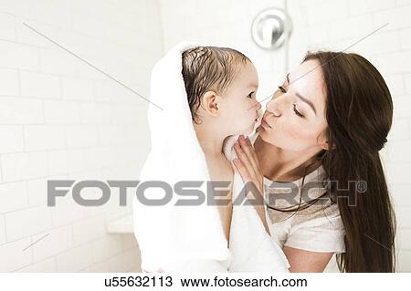 Mother kissing son (4-5) in bathroom View Large Photo Image Stock Image - Mother kissing son (4-5) in bathroom. Fotosearch