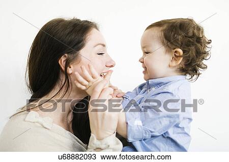 Stock Image - Mother playing with son (4-5). Fotosearch