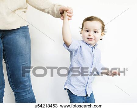 Stock Image - Mother posing with son (4-5). Fotosearch