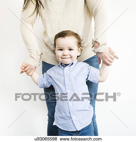 Stock Photo - Mother posing with son (4-5). Fotosearch