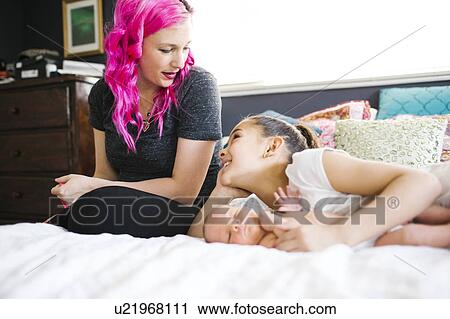 Mother spending time with children (10-11, 2-5 months) View Large Photo Image Stock Image - Mother spending time with children (10-11, 2-5 months). Fotosearch
