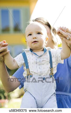 Mother with baby boy (12-17 months) View Large Photo Image Stock Photography - Mother with baby boy (12-17 months). Fotosearch