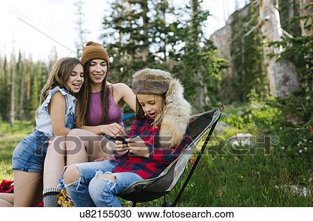 Mother with son (6-7) and daughter (8-9) camping in forest View Large Photo Image Stock Image - Mother with son (6-7) and daughter (8-9) camping in forest. Fotosearch